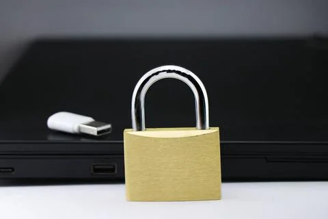Data privacy protection concept is shown using metal lock and storage device Stock Photos