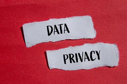 Data privacy words written on ripped white paper pieces with red background Stock Photos