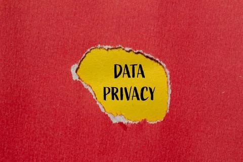 Data privacy words written on ripped red paper with yellow background Stockfoto's