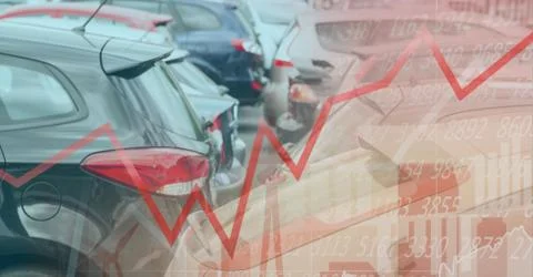 Data processing and graph with cars in background Foto stock