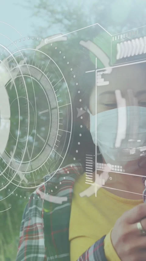 Data processing and round scanner against woman wearing face mask using Stock Footage 343902071