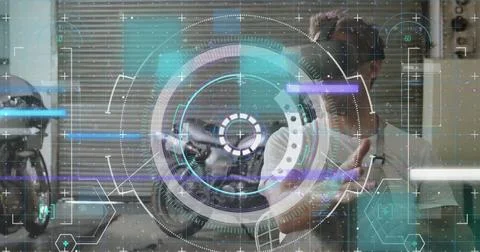 Data processing and scope scanning over caucasian man wearing vr headset in the Stock Photos
