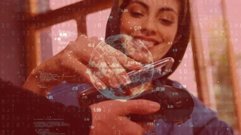 Data processing and spinning globe against caucasian woman making a payment Stock Footage 330473661