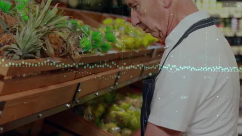 Data processing animation over elderly man selecting produce in grocery store Stock Footage 305021328