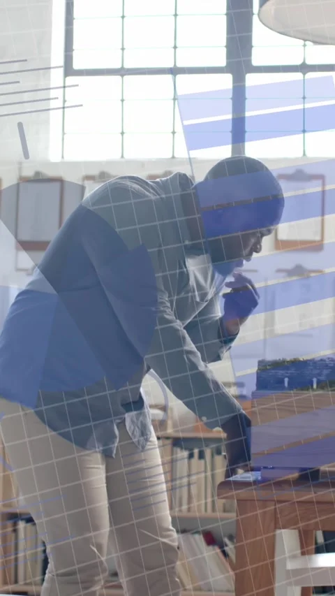 Data processing on interface over african american male architect with building Stock Footage 342595157