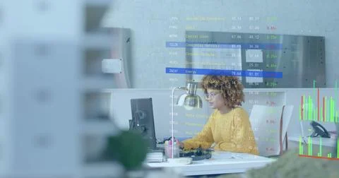 Data processing on interface over diverse female colleagues discussing at desk Foto stock