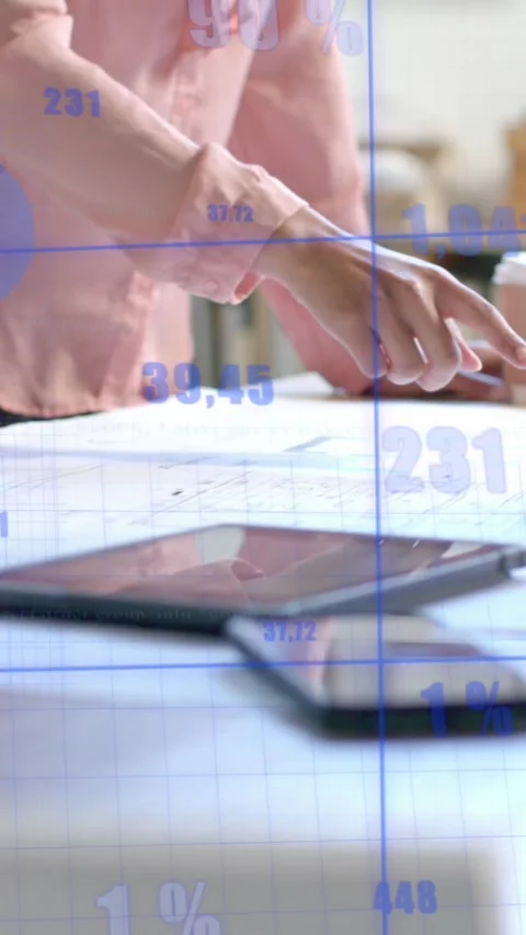 Data processing on interface over hands of diverse architects discussing Stock Footage 319513944