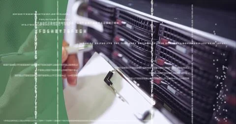 Data processing on mid section of worker worker in server room against green Stock Photos