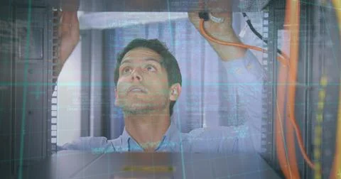Data processing over caucasian male engineer working at computer server room Stockfoto's