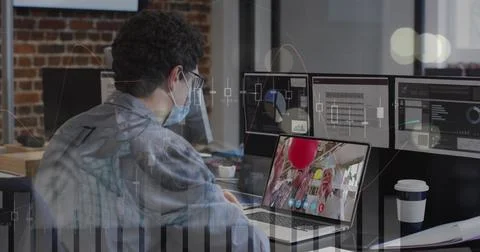 Data processing over caucasian man wearing a face mask having a image call on Stock Photos