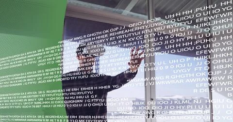 Data processing over man wearing vr headset at office against green technology Foto stock