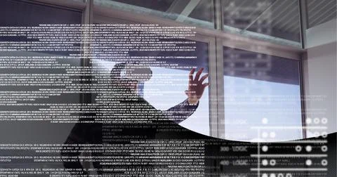 Data processing over man wearing vr headset at office against technology Stock Photos
