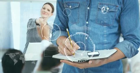 Data processing over mid section of a man writing on clipboard against Stock Photos