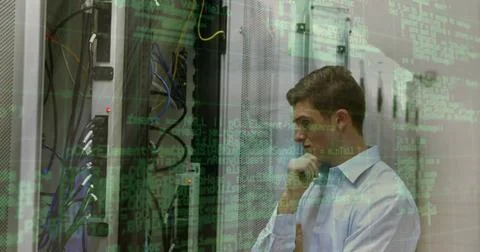 Data processing over portrait of caucasian male engineer smiling at computer 스톡 사진