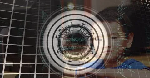 Data processing over round scanner over portrait of asian boy using computer at Stockfoto's