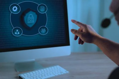 A data protection privacy person using computer with cybersecurity and data p Stockfoto's