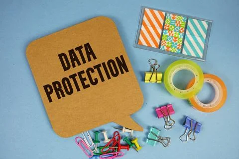Data Protection text with stationery on blue background 스톡 사진