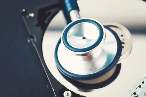 Data recovery or computer forensics concept, stethoscope dusty dismantle hard Foto stock