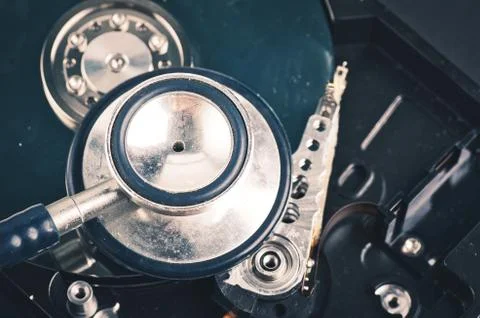 Data recovery or computer forensics concept, stethoscope dusty dismantle hard Foto stock