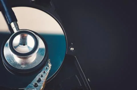 Data recovery or computer forensics concept, stethoscope dusty dismantle hard Foto stock