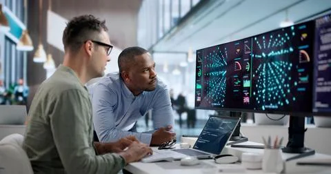 Data Scientist Analyzes AI Models On Laptop Using Advanced Software Tools. Stock Photos