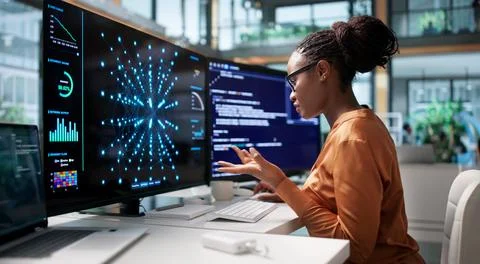 Data Scientist Analyzes Complex Neural Network Models On Her Black Laptop. Stock Photos