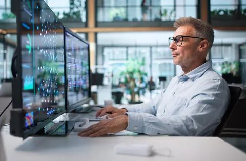 Data Scientist Analyzes Data Using Machine Learning Tools On Desktop Computer Stock Photos