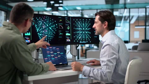 Data Scientist And Engineer Collaborate Using AI Tools Stock Footage 346932888
