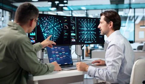 Data Scientist And Engineer Collaborate On Laptop Using AI Tools Together. 스톡 사진