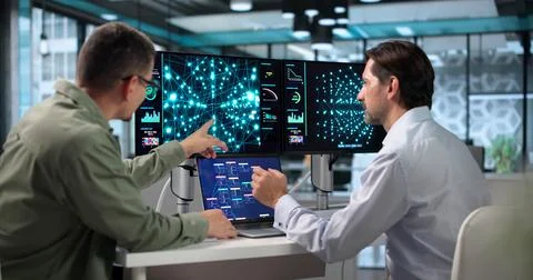 Data Scientist And Engineer Collaborate On Computer Models Using AI Tools Tog 库存照片