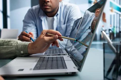 Data Scientist And Engineer Discuss AI Software Development Using Laptops. Stock Photos