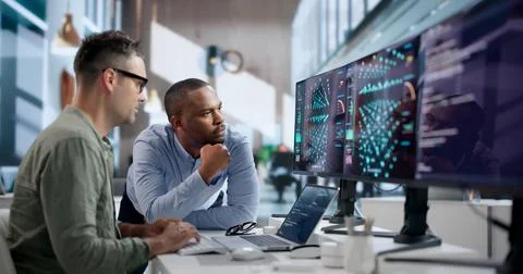 Data Scientist Carefully Analyzes AI Models Using Laptop And Software Tools. Stockfoto's