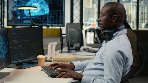 Data scientist in office doing software development to launch new features Stock Footage 323408406