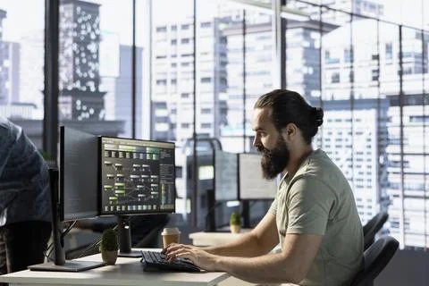 Data scientist at PC desk developing machine learning algorithms Stock Photos