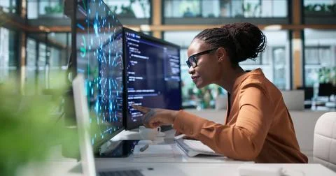 Data Scientist Reviews Neural Network Models On Laptop For AI Research. Stock Photos