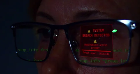 Data scientist wearing glasses analyzing code on a screen and an unauthorized   Video stock 331205110