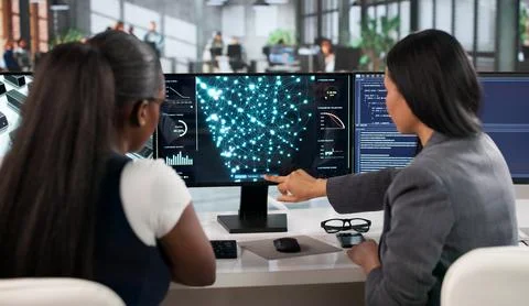 Data Scientist Woman Carefully Developing Neural Network Models On Computer. Stock Photos