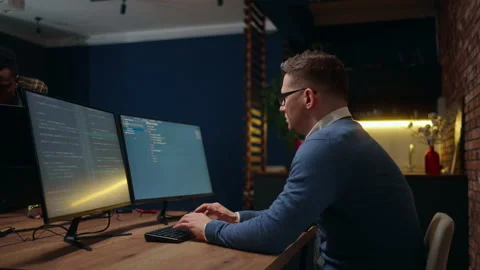 Data scientist working in office, man is coding and programming on big data Stock Footage 233739092