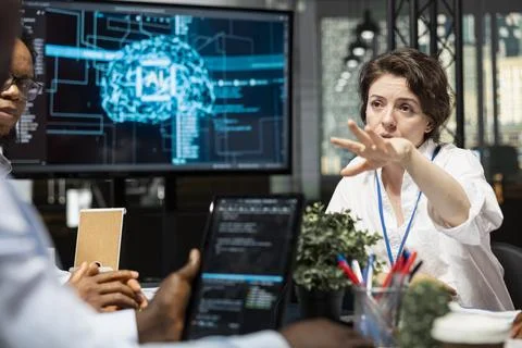 Data scientists in artificial intelligence startup office doing brainstorming 스톡 사진