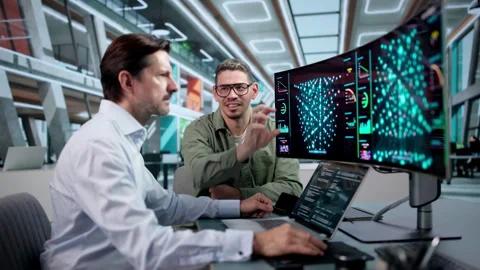Data Scientists Collaborate Using AI Tools On Laptop Stock Footage 346326810