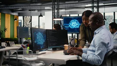 Data scientists doing brainstorming in office, using AI specialized hardware Stock Photos