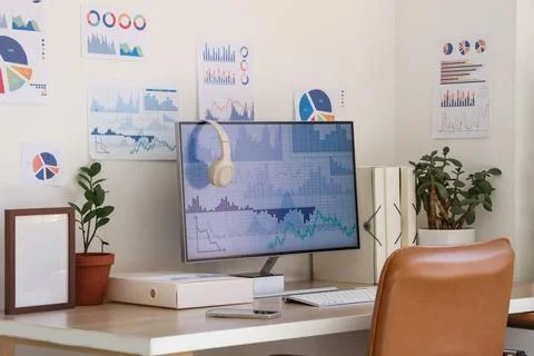 Data scientist's workplace with computer and diagrams in office 写真素材