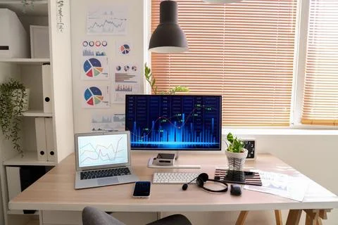 Data scientists workplace with computer and diagrams in office 写真素材