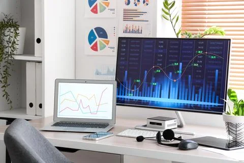 Data scientist's workplace with computer and diagrams in office 写真素材