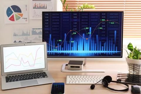 Data scientist's workplace with computer and diagrams in office 写真素材
