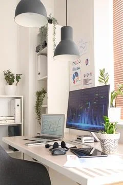 Data scientists workplace with computer and diagrams in office 写真素材