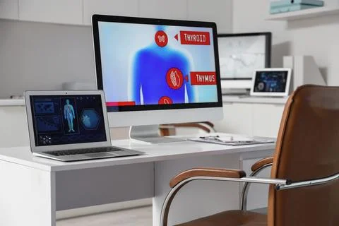 Data scientist's workplace with computer and laptop in laboratory Stock Photos