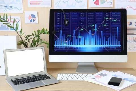 Data scientist's workplace with diagrams in office Stock Photos