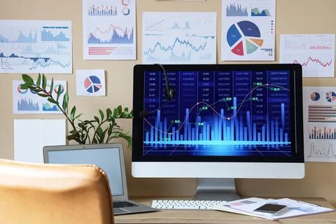 Data scientist's workplace with diagrams in office Stock Photos