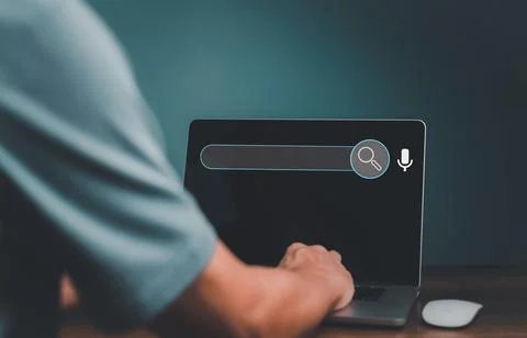 Data Search Technology , Engine Optimization. Man's hands using a laptop comp Stock Photos